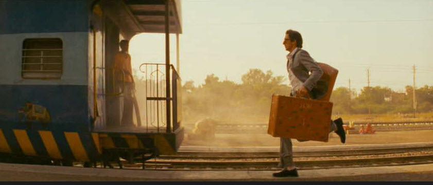 A man running behind a train
